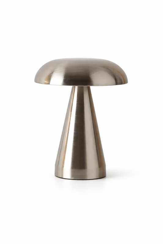 Metallic table lamp with a unique design on a white background