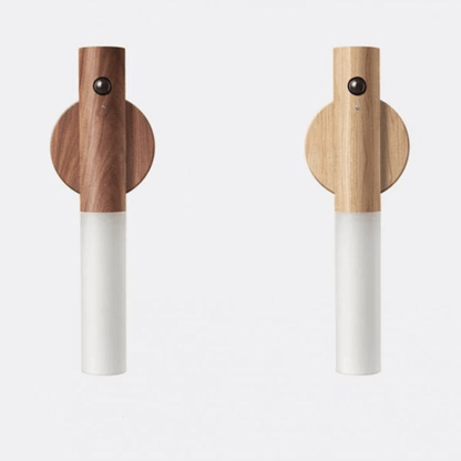 Two wooden cordless torches with white bodies on a light gray background
